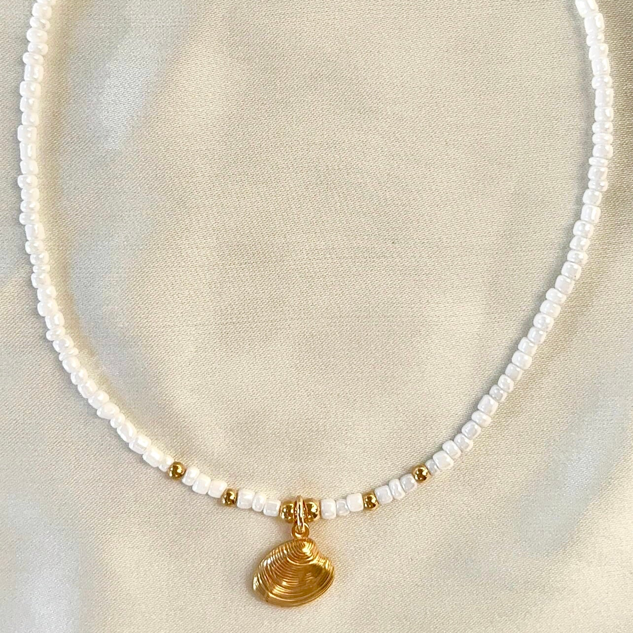 shell necklace with white beads