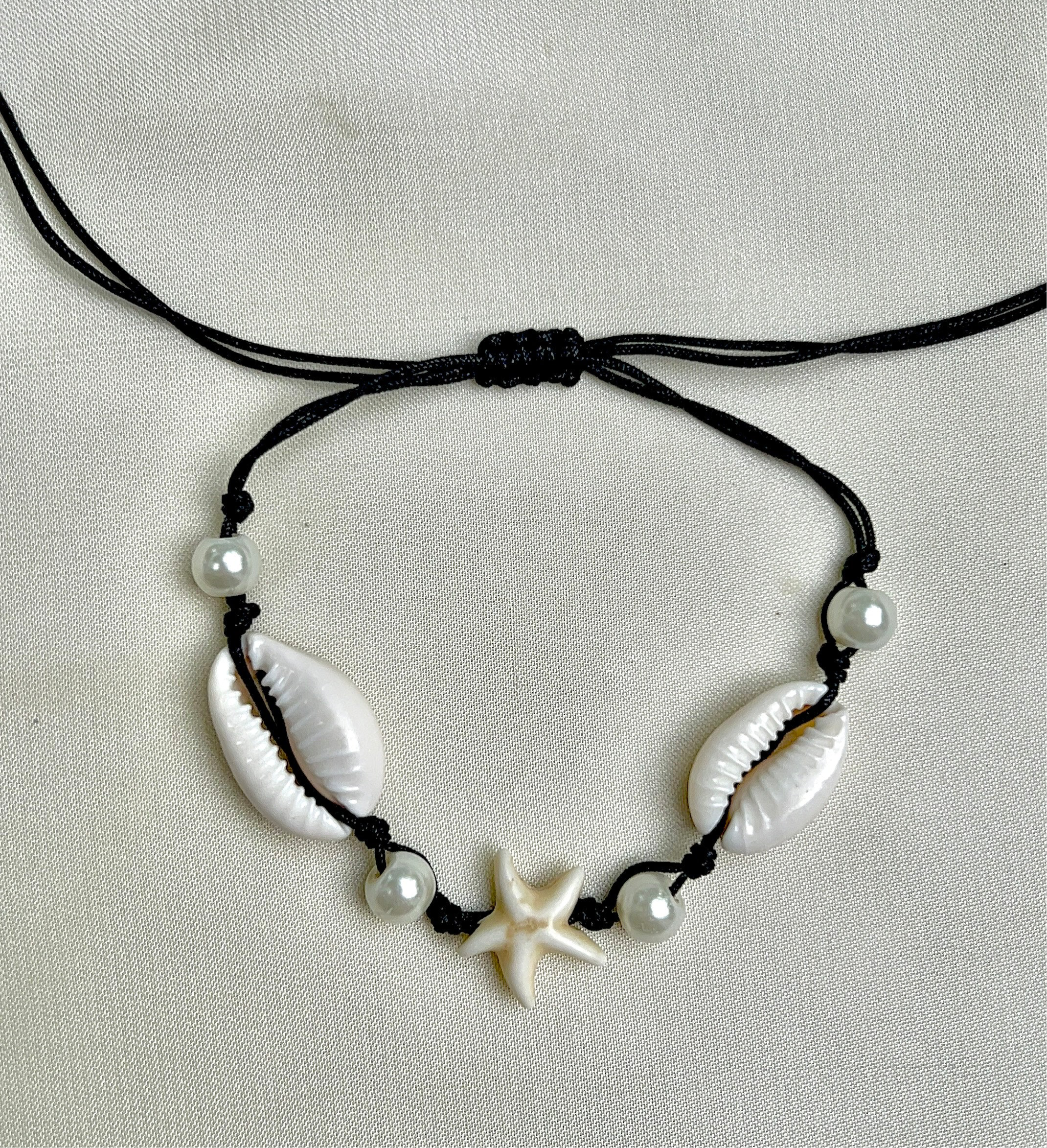 thread bracelet shell beach