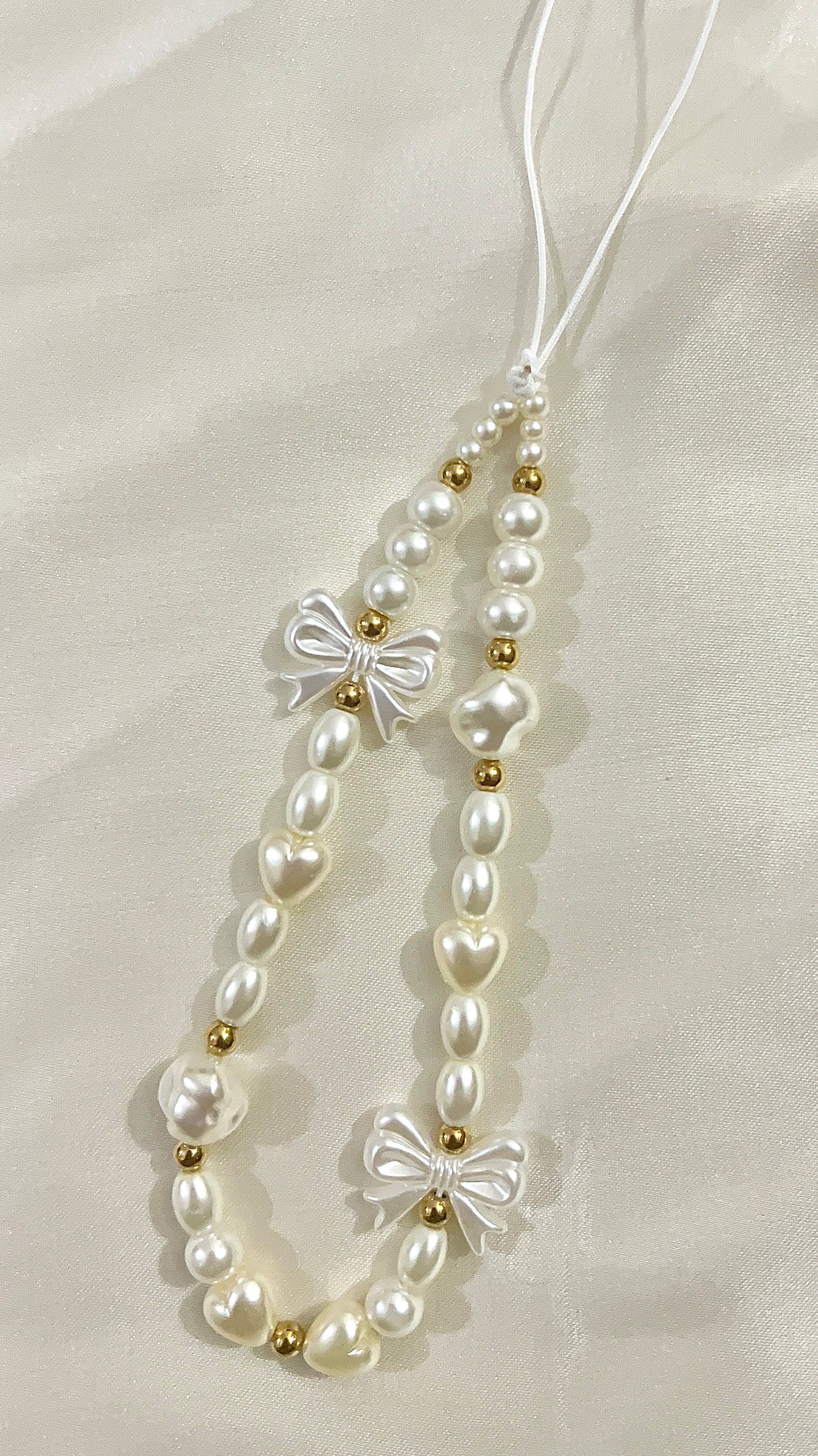 pearl and bow phone charm