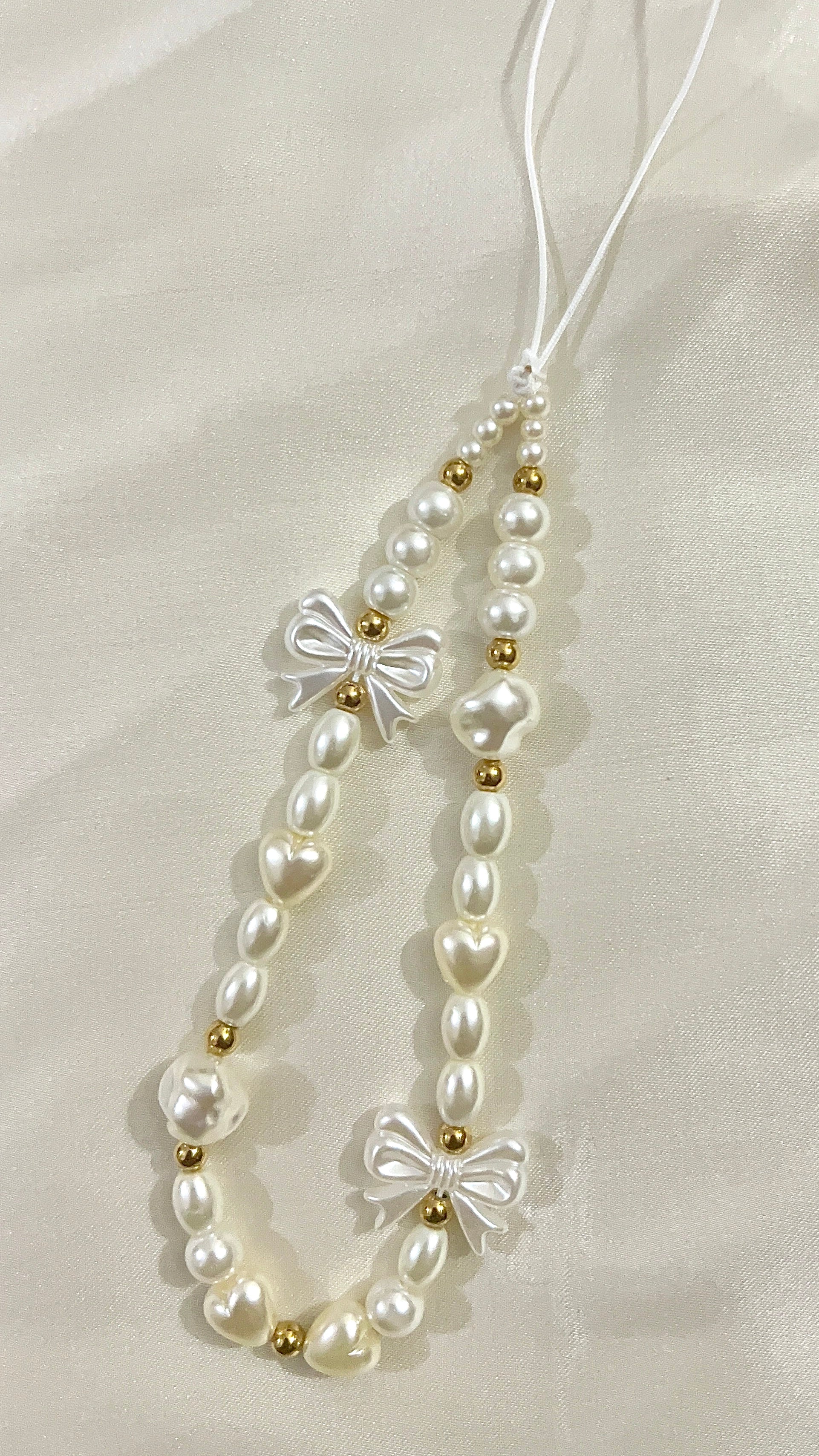 pearl and bow phone charm