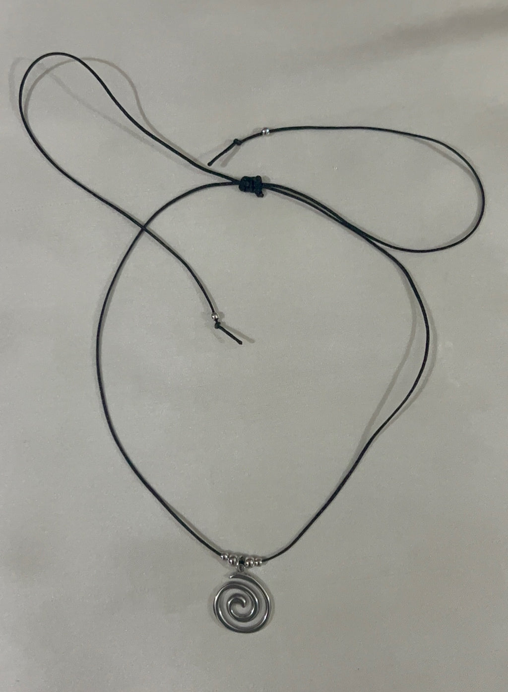 swirly silver necklace